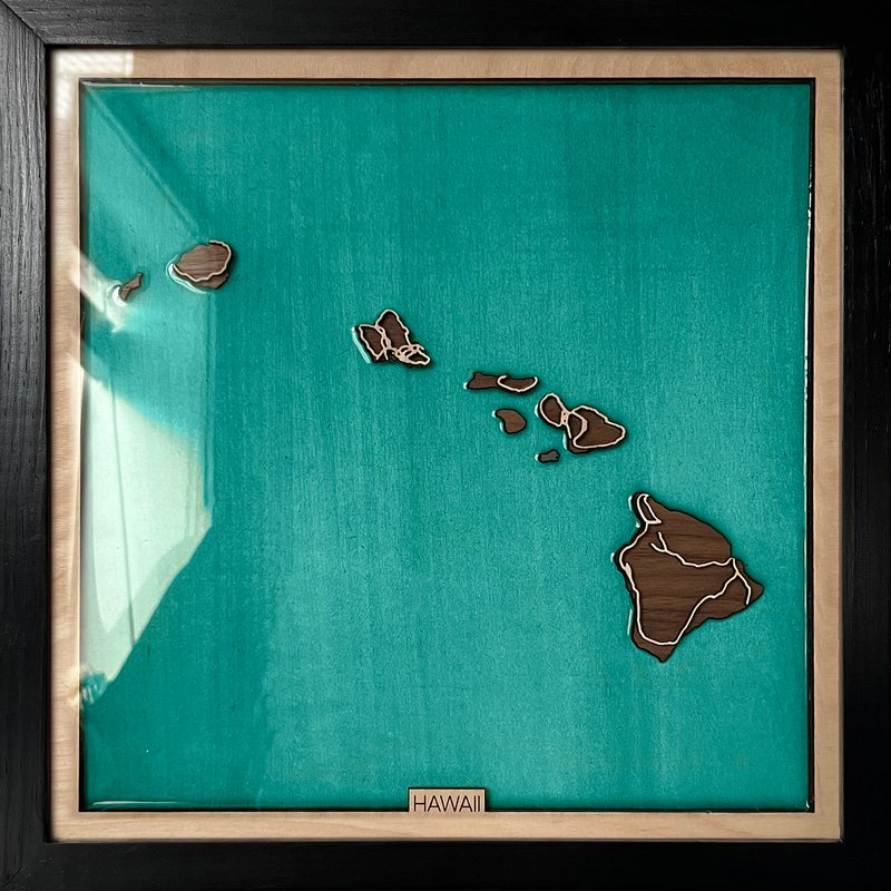 Wooden map of the Hawaiian Islands in a turquoise Pacific
